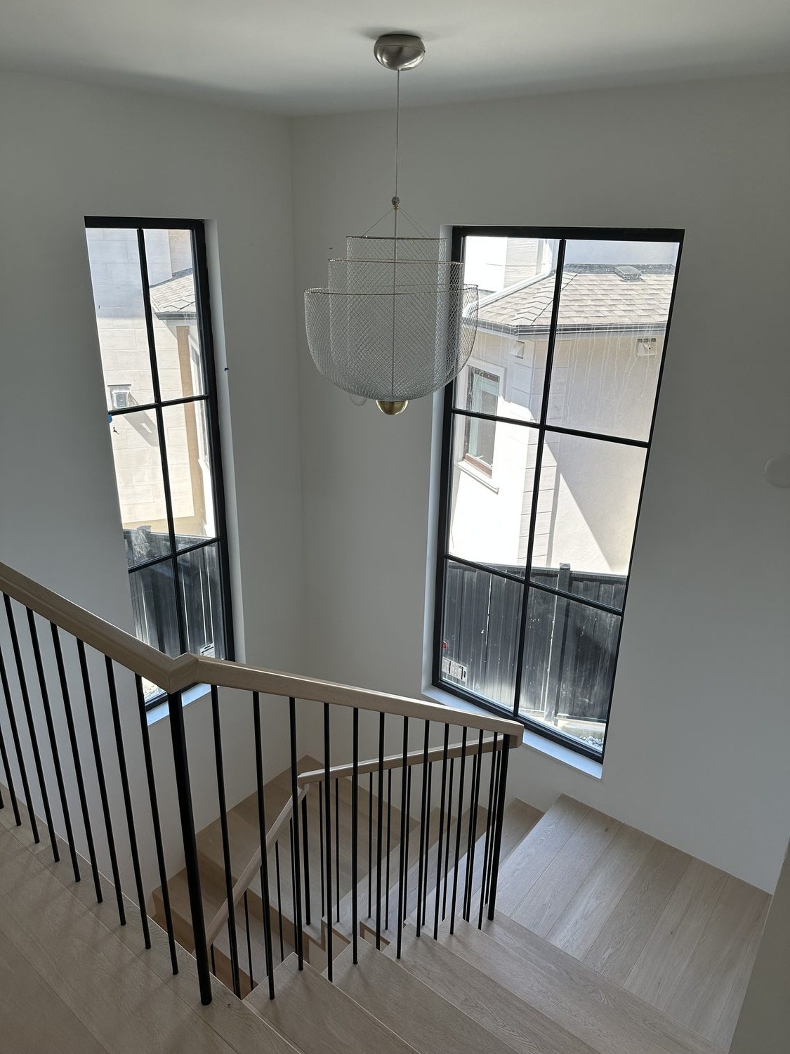 Stairwell with sculptural pendant light
