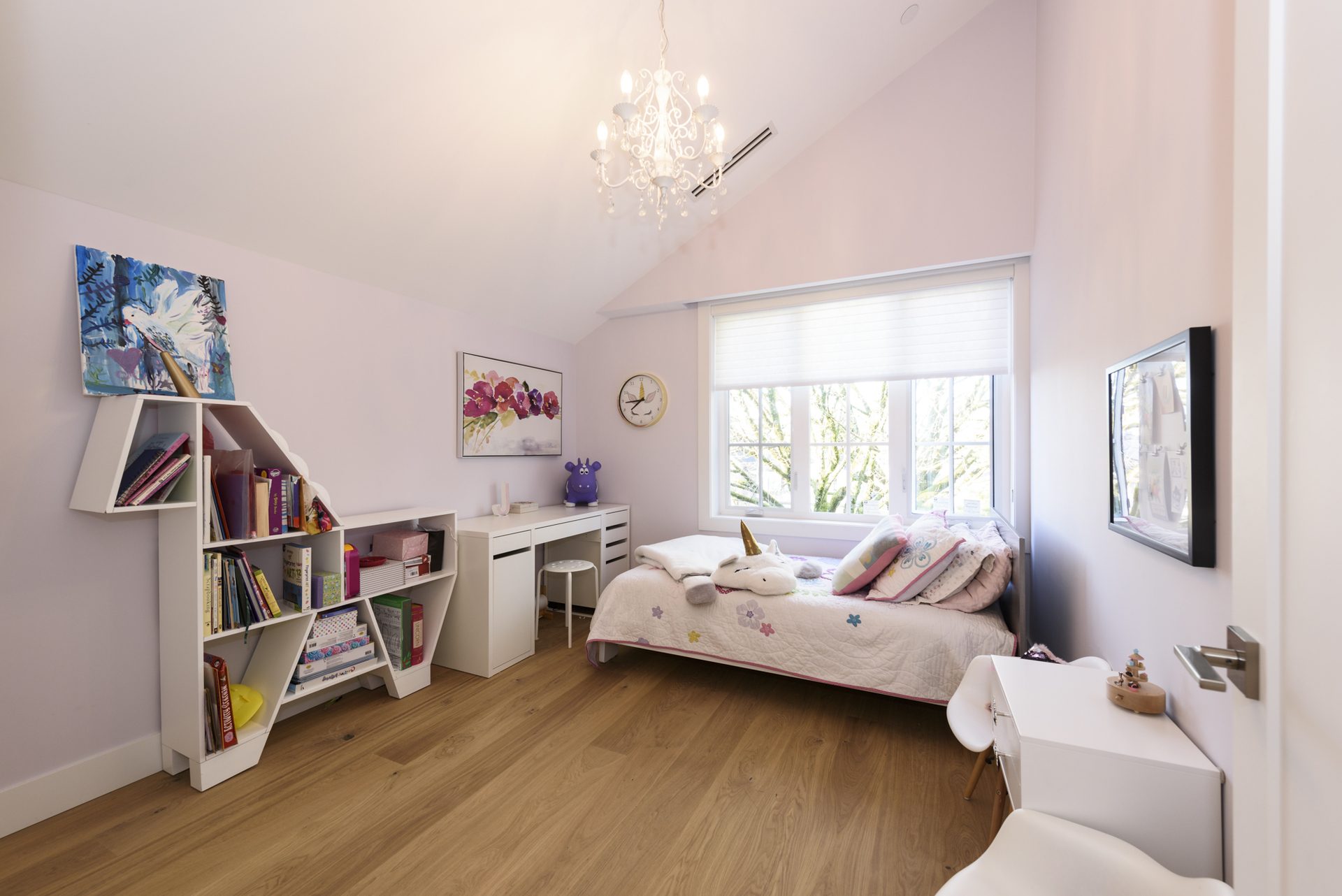 Children's bedroom with chandelier and reading nook