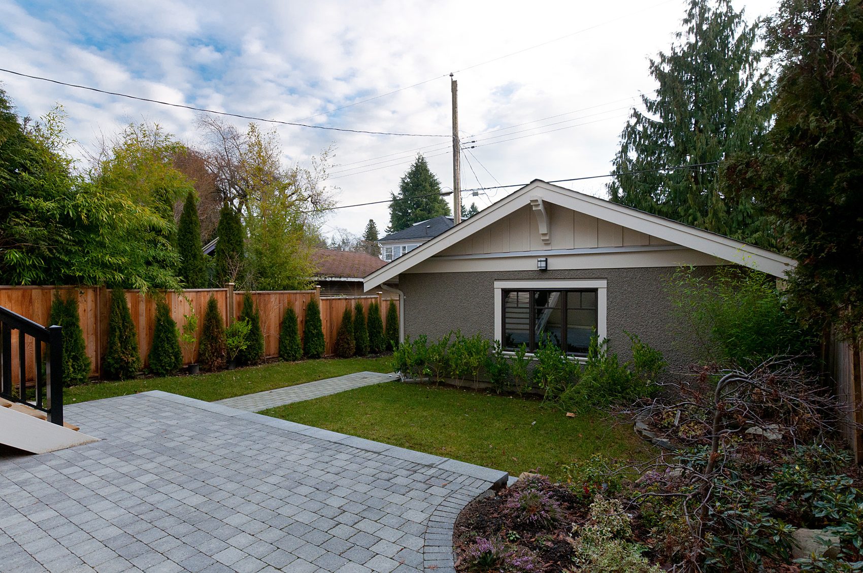 Detached laneway garage and paved rear yard