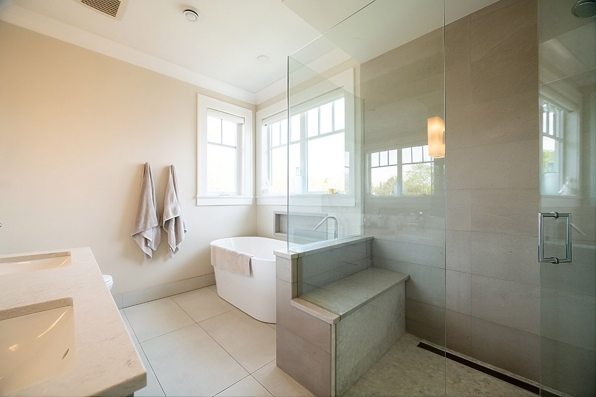 Bathroom with freestanding tub and glass shower