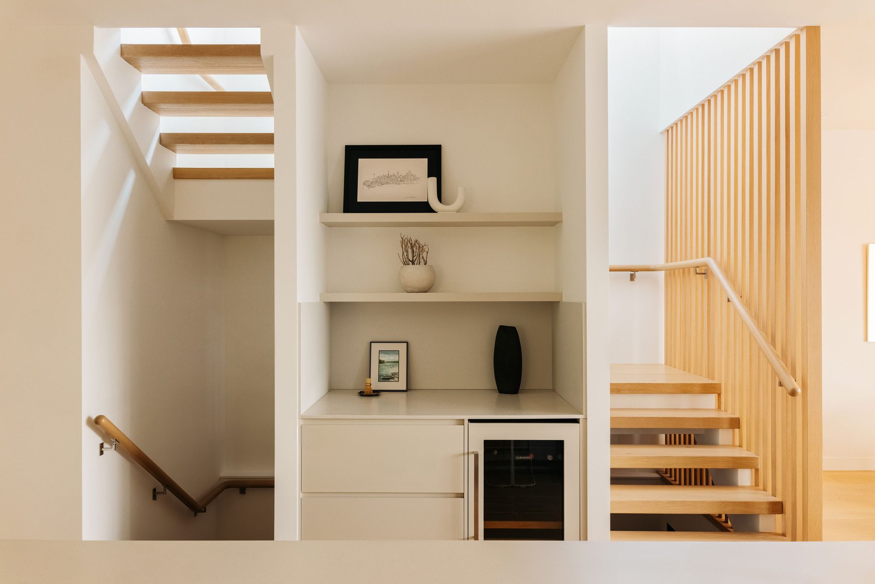 Open-tread staircase with built-in display nook