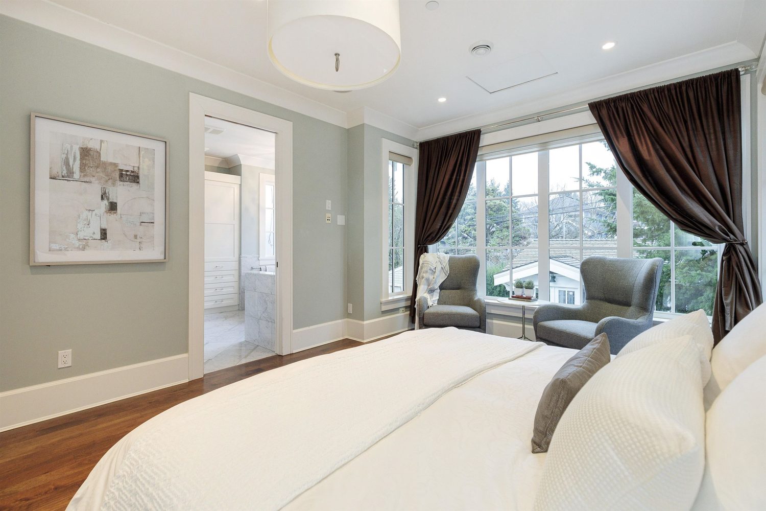 Primary bedroom with vaulted ceiling