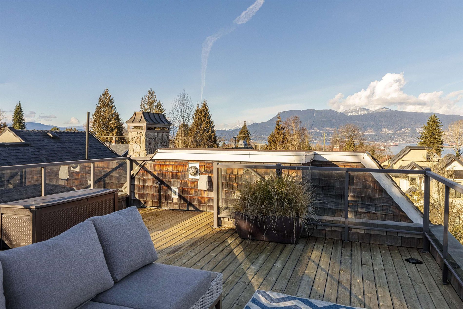 Rooftop deck with mountain and water views